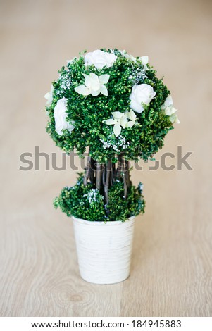 Decoration - green bush with flowers in metal bucket