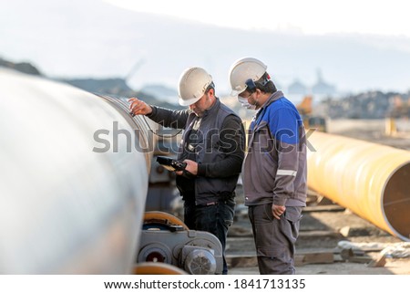 Technician are testing to welds of pipe with ultrasonic test method. It is a family of non-destructive testing techniques based on the propagation of ultrasonic waves in the object or material tested.