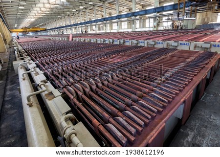 Copper electrolysis-cathode plates. The copper is refined by electrolysis. The anodes cast from processed blister copper are placed into an aqueous solution (copper sulfate and  sulfuric acid).