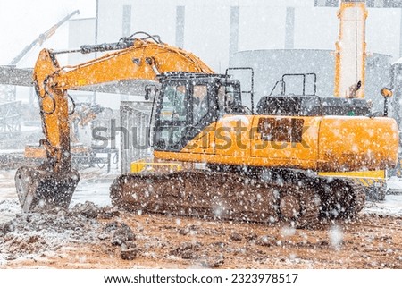 Similar – Image, Stock Photo Shoving snow on the roof. Remove snow from solar system