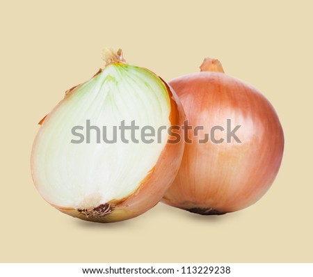 Onions cut in half on a yellow background.
