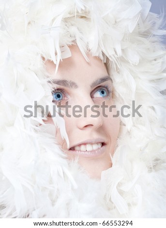 Beautiful woman with white feathers