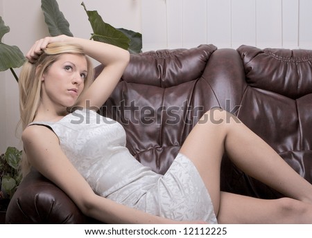 Beautiful girl relaxing on sofa