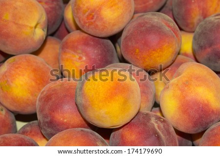 Peach close up. Peach background. Fresh Organic Peaches. Heap Of Fresh Ripe Peaches