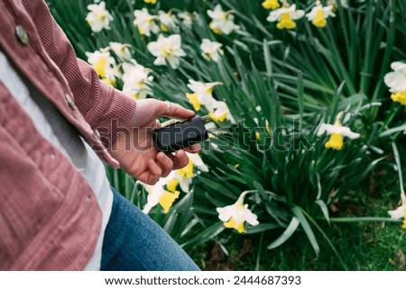 Similar – Image, Stock Photo Modern relaxed woman vaping while sitting on marked road