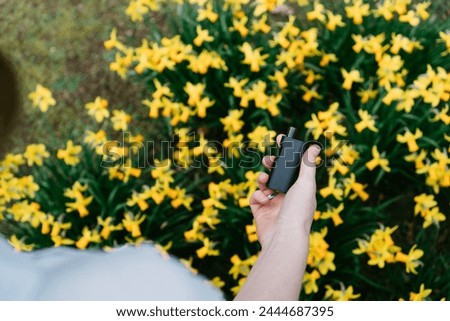 Similar – Image, Stock Photo Modern relaxed woman vaping while sitting on marked road