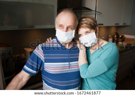 Similar – Image, Stock Photo Senior couple wearing protective face masks outdoors