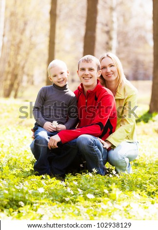 happy young family spending time outdoor on a summer day