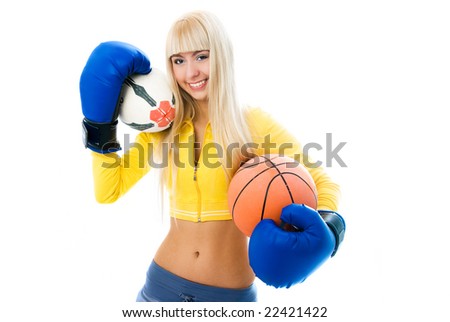 beautiful cheerful blond girl wearing boxing gloves and holding two balls in her hands