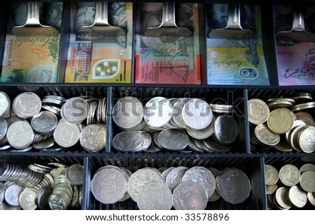 Open cash register with Australian currency, notes and coins