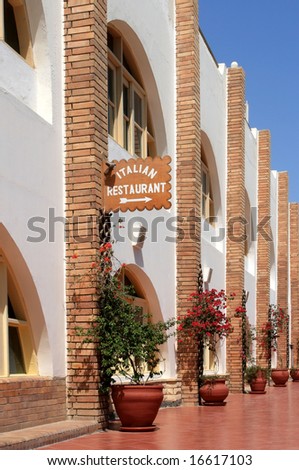 Signboard with direction to the italian restaurant in hotel