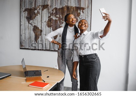 Similar – Image, Stock Photo Cheerful black friends taking selfie in city