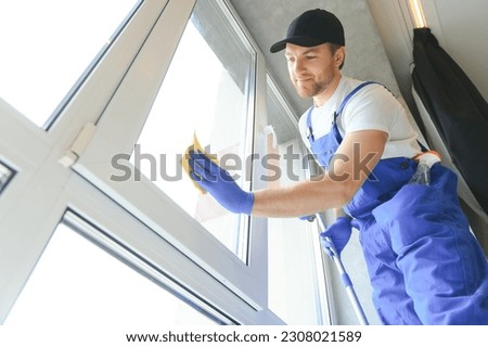 Similar – Image, Stock Photo Man washing window in yellow rubber gloves