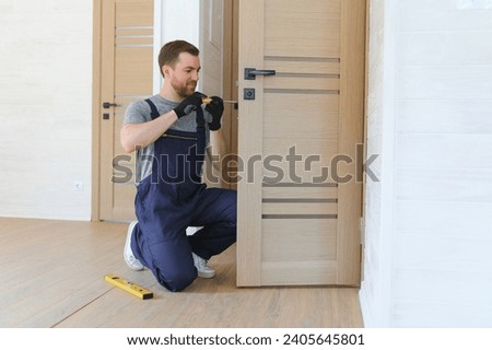 Image, Stock Photo young handyman installing wooden floor