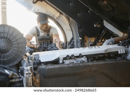 Similar – Image, Stock Photo Repairman with headphones in workshop