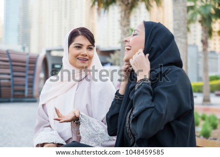 Similar – Image, Stock Photo Positive Arab woman having video call in park