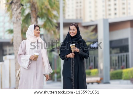 Similar – Image, Stock Photo Positive Arab woman having video call in park