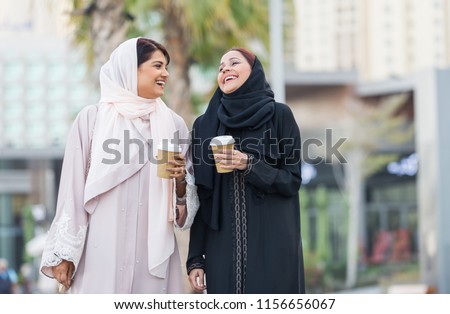 Similar – Image, Stock Photo Positive Arab woman having video call in park