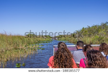 EVERGLADES - NOVEMBER 30,2013:  tourists on airboat.Everglades National Park in South Florida has stopped issuing new permits for private airboats