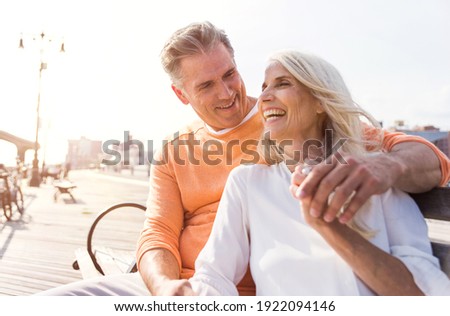 Similar – Image, Stock Photo Senior couple hugging outdoors in autumn