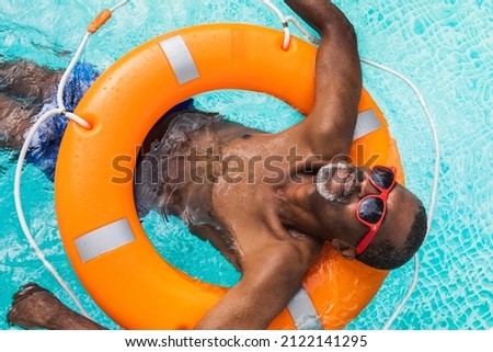 Image, Stock Photo Active senior man swimming and splashing in water