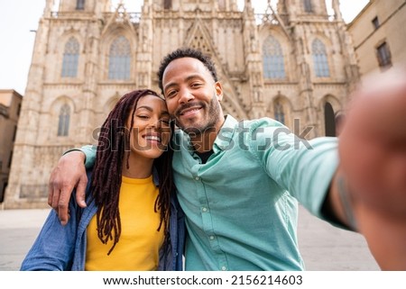 Beautiful happy hispanic latino couple of lovers dating outdoors - Tourists in Barcelona having fun during summer vacation and visiting Barcelona Cathedral historic landmark ストックフォト © 