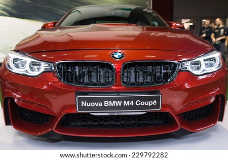MILAN, IT. NOVEMBER 5, 2014. The new BMW m4 exposed at EICMA 2014. The BMW M4 is a high-performance version of the 4 Series automobile developed by BMW\'s in-house motorsport division.