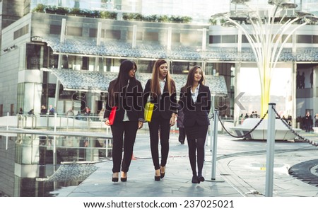 three business women walking in the business center