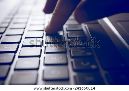 person digits on the computer keyboard. concept of technology, business, and professions