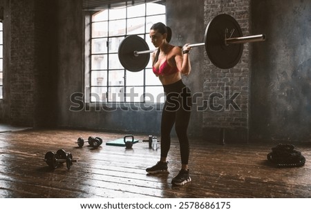 Similar – Image, Stock Photo Female athlete doing pull up exercises