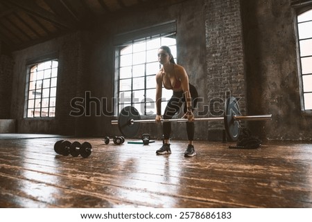 Similar – Image, Stock Photo Female athlete doing pull up exercises