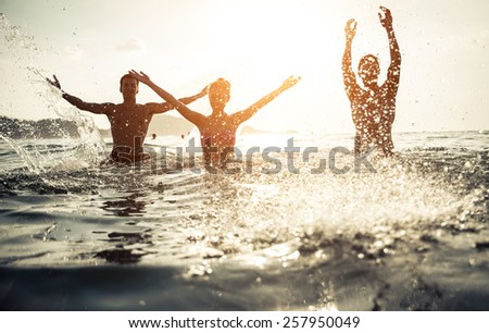 Similar – Image, Stock Photo Friends splashing with water guns