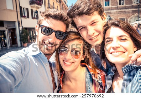 Group of friends taking a selfie - Students smiling at camera and having fun outdoors in a sunny day - Students enjoying the coming of spring