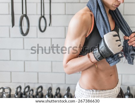woman trained body after gym and cross fit session. concept about people and sport