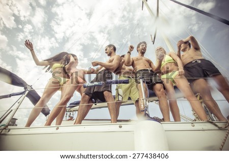 group of friends making party on the boat. concept about transportation, fun, happiness,youth, boat and people