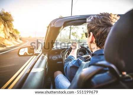 Couple of lovers driving on a convertible car - Newlywed pair on a romantic date Foto stock © 