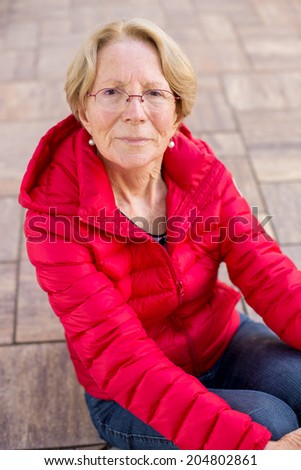 A nice elderly woman is worrying