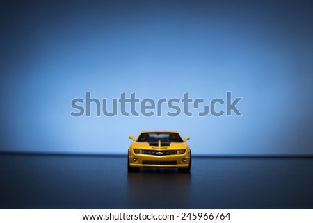 Chevrolet Camaro toy car product shot on blue background. Chevrolet is a automobile manufacturer at USA. Owner is General Motors Company. Shoot date and location: Turkey - Izmir. January 14 2015