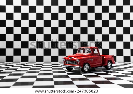 Chevrolet 3100 pickup toy car product shot on checkered background. Chevrolet is a automobile manufacturer . Owner is General Motors Company. Shoot date and location: Turkey - Izmir. January 24 2015