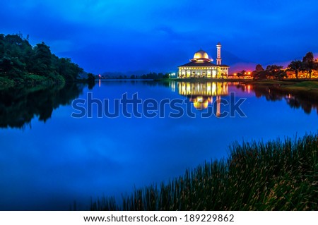 Darul Quran mosque during blue hour with full reflection