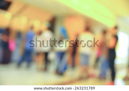 Blur image of people queue at automatic teller machine (ATM)