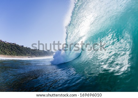Ocean Wave Crashing Swimming Ocean Waves Crashing Ocean wave swells surging forward and crashing onto shallow reefs and sandbars with energy and power