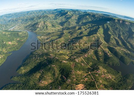 Air Flying Landscape Dam Rural Homes Air flying birds eye view of over Inanda dam valley terrain of thousand hills with homes over colorful landscape