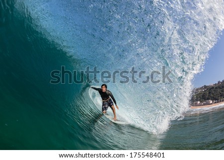 Surfing Inside Hollow Blue Wave Surfer tube riding inside hollow blue crashing wave