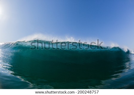 Wave Swimming Inside Blue Crashing Water Blue ocean sea wave wall of water closeup swimming inside crashing hollow scenic power of nature