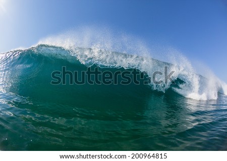 Wave Swimming Closeup Crashing Blue Closeup swimming inside of ocean wave crashing breaking blue water on shallow sandbar