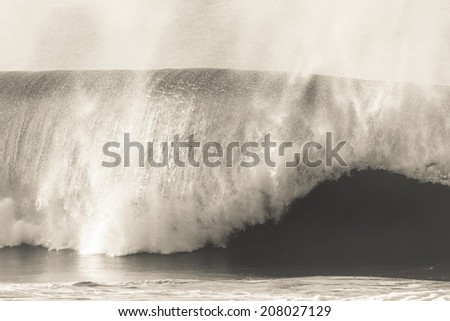 Wave Crashing Beach Black White Vintage Ocean wave crashing towards beach coastline in black white vintage tone