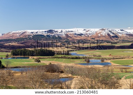 Mountains Valley Agriculture Snow Scenic mountain valley agriculture farming landscape  terrain with snow in color contrasts of seasons in nature