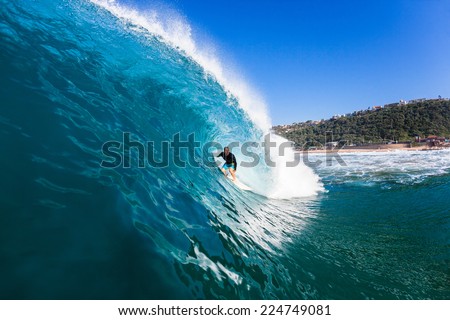 Surfing Inside Hollow Blue Wave Surfing surfer tube rides inside large hollow blue water ocean wave