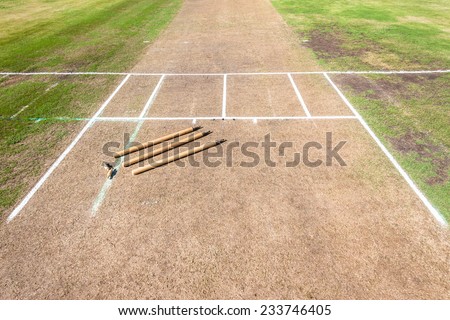 Cricket Wickets Field Cricket pitch and wicket bails stumps painted batting crease closeup detail on field